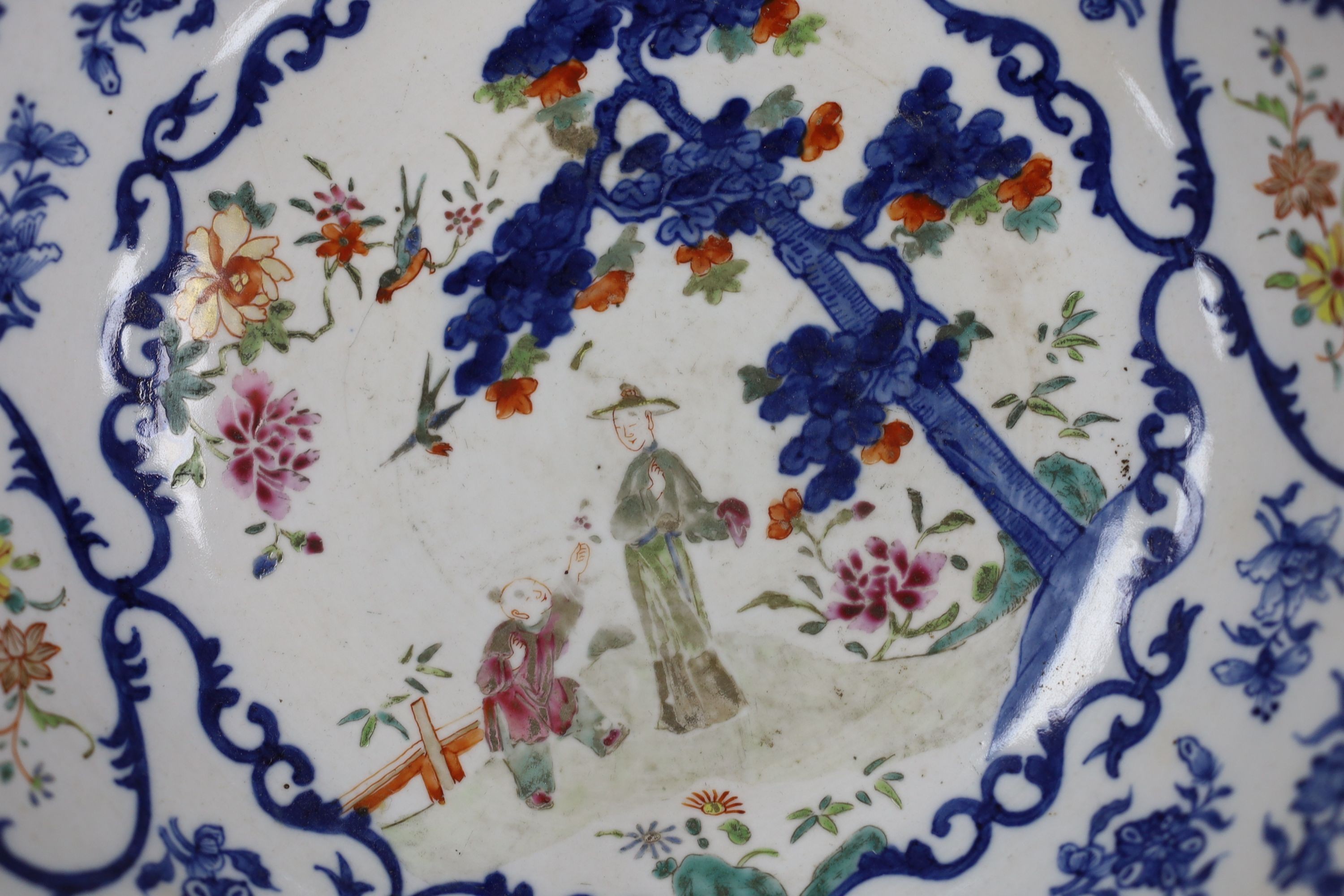 A Chinese underglaze blue and famille rose decorated basin or bowl, Qianlong period, 27 cm diameter